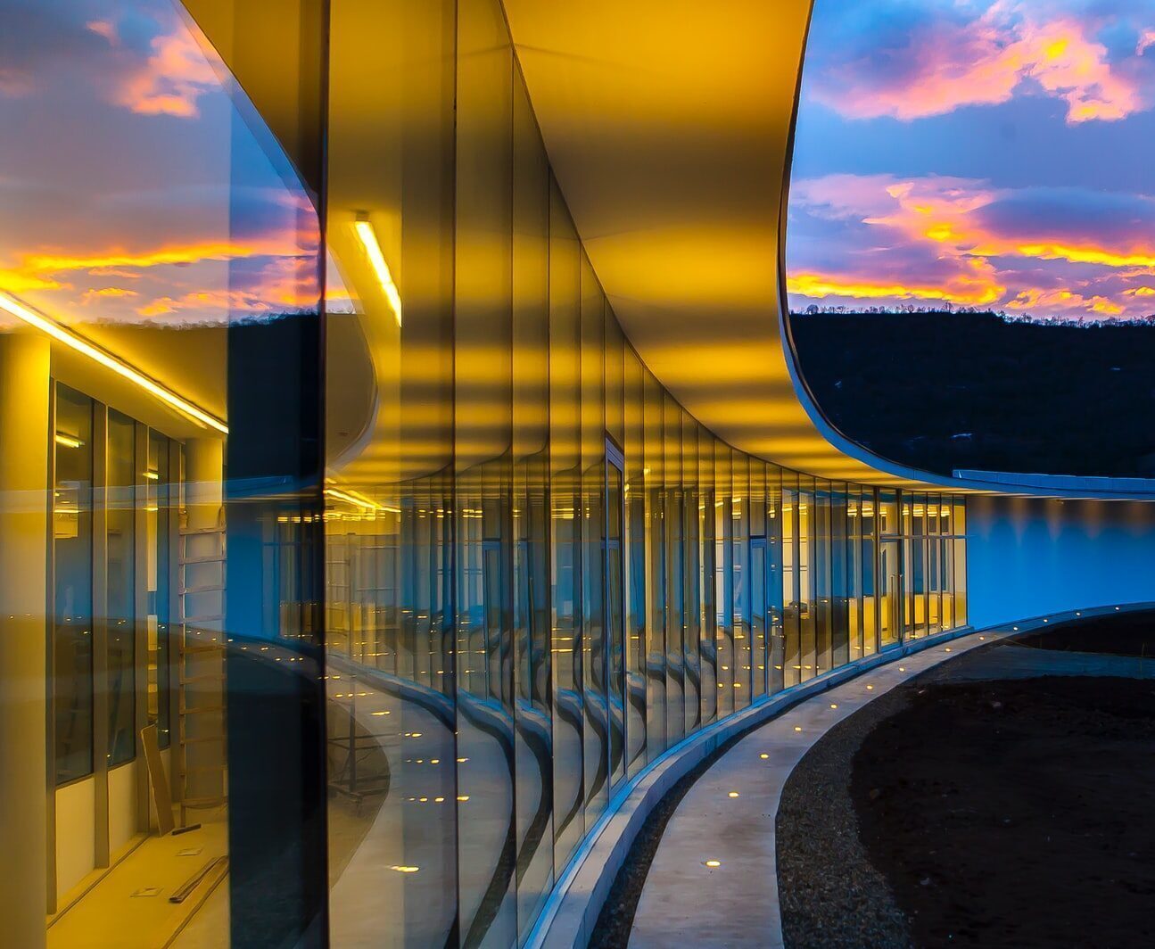 Photo by Nerses Khachatryan clear glass wall building under blue sky with clouds